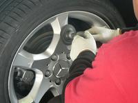 Photo of Wheel Magic, Inc's expert mobile technicians making wheel repair to a Mercedes Benz wheel in San Jose Bay Area