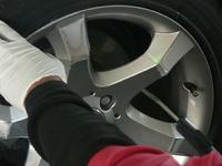 Photo of Wheel Magic, Inc. mobile alloy wheel repair technicians using the most current and advanced methods in the industry to perform wheel repair on Mercedez Benz wheel in San Jose Bay Area