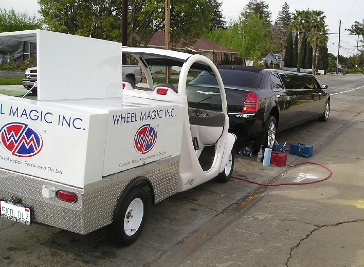 Photo of Wheel Magic, Inc. mobile wheel repair wagon and limousine while technician performing wheel repair in San Jose